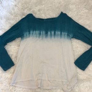 Long sleeve blue and white colored shirt bow looking tie in the back